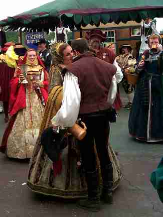 Each of the Rogues presents a rose