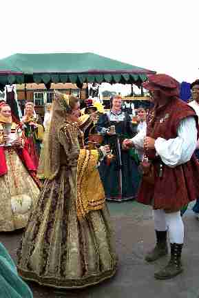 Each of the Rogues presents a rose