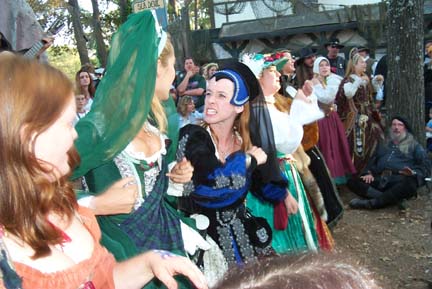 Cat Fight at the Pub Sing - In the black and blue gown is Padraigella, evil stepsister, played by the lovely Darksilver